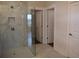 Bathroom featuring a glass shower with tile surround at 1619 Tielman Way, Snellville, GA 30078