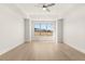 Bright bedroom with tray ceiling, ceiling fan, and a large window offering ample natural light at 1619 Tielman Way, Snellville, GA 30078