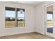 Bright dining area with a modern hanging light fixture and a glass-paneled door at 1619 Tielman Way, Snellville, GA 30078