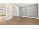Dining area with decorative wall, modern chandelier, hardwood floors, and great natural light at 1619 Tielman Way, Snellville, GA 30078