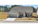 Beautiful single-Gathering home featuring light brick, gray shutters, a two-car garage, and a well-maintained lawn at 1619 Tielman Way, Snellville, GA 30078