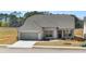 Charming single-story home with gray brick, gray shutters, and a well-manicured lawn at 1619 Tielman Way, Snellville, GA 30078