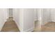 Hallway showcasing modern trim work leading to other areas of the home at 1619 Tielman Way, Snellville, GA 30078