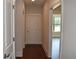 Hallway featuring hardwood floors and white doors with modern trim at 1619 Tielman Way, Snellville, GA 30078