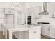 Bright kitchen featuring a large quartz island, stainless steel appliances, and a subway tile backsplash at 1619 Tielman Way, Snellville, GA 30078