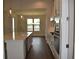 Bright kitchen featuring a large island, modern white cabinets, and stainless steel appliances at 1619 Tielman Way, Snellville, GA 30078