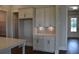 Elegant kitchen features stylish white cabinets with a prep area for appliances at 1619 Tielman Way, Snellville, GA 30078