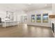 Bright, open-concept living space with modern kitchen, fireplace, and expansive windows at 1619 Tielman Way, Snellville, GA 30078