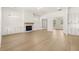 Spacious living room with hardwood floors, built-in cabinets, and a fireplace at 1619 Tielman Way, Snellville, GA 30078