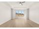 Large main bedroom with a tray ceiling, ceiling fan, and a bright window view at 1619 Tielman Way, Snellville, GA 30078