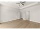 Open and airy bedroom with ceiling fan and convenient access to closets and en-suite bathroom at 1619 Tielman Way, Snellville, GA 30078
