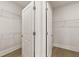 Spacious walk-in closet with ample storage space at 1619 Tielman Way, Snellville, GA 30078