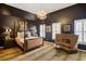 Chic bedroom with plush carpeting, a decorative chandelier, and a four-poster bed at 195 Mystic Ct, Atlanta, GA 30342