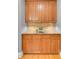 Kitchen features granite countertops, wood cabinets, and decorative backsplash at 195 Mystic Ct, Atlanta, GA 30342