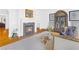 Elegant living room featuring a fireplace, hardwood floors, and classic display case at 195 Mystic Ct, Atlanta, GA 30342