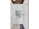 Contemporary shower with glass enclosure and white tile accented with a geometric stone inset at 195 Mystic Ct, Atlanta, GA 30342