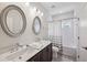 Bathroom featuring a double vanity, tile flooring, shower, and tub at 2059 Wheaton Way, Atlanta, GA 30328