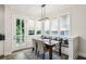 Inviting breakfast nook with built-in seating, natural light, and access to porch at 2059 Wheaton Way, Atlanta, GA 30328