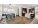 Open concept living room adjacent to kitchen and breakfast nook, offering flexible living at 2059 Wheaton Way, Atlanta, GA 30328