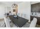 Stylish dining room with large table, seating for six, and adjacent bar area at 2059 Wheaton Way, Atlanta, GA 30328