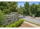 Community entrance at The Water's in Sandy Springs, showcasing stone signage and secure gated entry at 2059 Wheaton Way, Atlanta, GA 30328