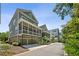 Stylish townhomes with inviting screened porches and well-maintained landscaping at 2059 Wheaton Way, Atlanta, GA 30328