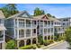 Charming townhomes with multi-level screened porches and elegant architectural details at 2059 Wheaton Way, Atlanta, GA 30328