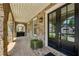 Charming front porch with brick arches, and a double door entry featuring sidelights at 2059 Wheaton Way, Atlanta, GA 30328