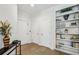 Hallway features built-in bookshelves, hardwood flooring, and natural lighting at 2059 Wheaton Way, Atlanta, GA 30328