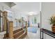 Upstairs hallway features wood floors, white walls, and natural lighting at 2059 Wheaton Way, Atlanta, GA 30328
