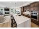 Gourmet kitchen with island bar overlooks a spacious living room with fireplace at 2059 Wheaton Way, Atlanta, GA 30328