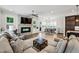 Open concept living room adjacent to kitchen and breakfast nook, offering flexible living at 2059 Wheaton Way, Atlanta, GA 30328