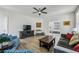 Bright living room showcases stylish seating, a ceiling fan, and elegant decor at 2059 Wheaton Way, Atlanta, GA 30328