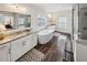 Bright primary bathroom featuring double sinks, a soaking tub and tiled shower at 2059 Wheaton Way, Atlanta, GA 30328