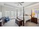 Relaxing primary bedroom featuring neutral decor, a ceiling fan, and natural light at 2059 Wheaton Way, Atlanta, GA 30328