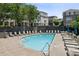 Community swimming pool and lounge area with plentiful seating and nearby landscaping at 2059 Wheaton Way, Atlanta, GA 30328