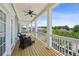 Spacious covered porch with outdoor furniture, offering views of the neighborhood at 2059 Wheaton Way, Atlanta, GA 30328