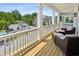 Inviting outdoor porch with comfortable seating and views of the community and pool at 2059 Wheaton Way, Atlanta, GA 30328
