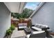 Cozy covered patio featuring comfortable outdoor seating and manicured landscaping at 2983 Crosswycke Forest Dr, Brookhaven, GA 30319
