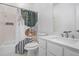 Bathroom featuring a shower/tub combination, toilet and single sink vanity at 2983 Crosswycke Forest Dr, Brookhaven, GA 30319