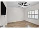Well-lit bedroom showcases wood floors, ceiling fan and bright shutters at 2983 Crosswycke Forest Dr, Brookhaven, GA 30319