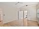 Bright bedroom features wood floors, ceiling fan, and ensuite bathroom at 2983 Crosswycke Forest Dr, Brookhaven, GA 30319