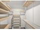 Organized walk-in closet with shelving and drawers for ample storage at 2983 Crosswycke Forest Dr, Brookhaven, GA 30319