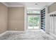 Living area with built-in shelves and sliding glass doors to backyard at 2983 Crosswycke Forest Dr, Brookhaven, GA 30319