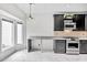 Bright kitchen with black cabinetry, stainless steel appliances, granite countertops and lots of natural light at 2983 Crosswycke Forest Dr, Brookhaven, GA 30319