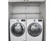Laundry area with stacked washer and dryer at 2983 Crosswycke Forest Dr, Brookhaven, GA 30319