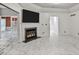 Bright living room with marble floors, fireplace, and views to additional rooms at 2983 Crosswycke Forest Dr, Brookhaven, GA 30319