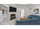Bright living room featuring a fireplace with marble surround and a modern sectional sofa at 2983 Crosswycke Forest Dr, Brookhaven, GA 30319