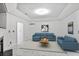 Bright and airy living room featuring tray ceiling, recessed lighting, and a comfortable sectional sofa at 2983 Crosswycke Forest Dr, Brookhaven, GA 30319