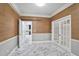 Office with warm wallpaper, bright natural light and french doors at 2983 Crosswycke Forest Dr, Brookhaven, GA 30319